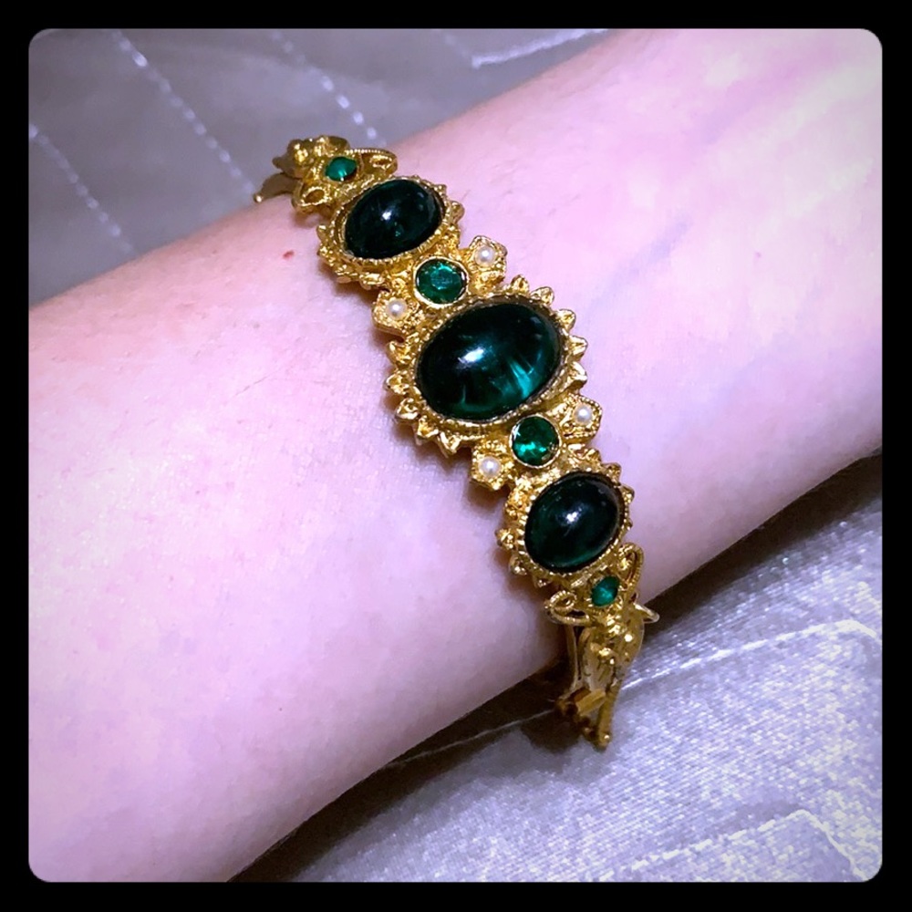 Vintage gold tone cuff with emerald green details